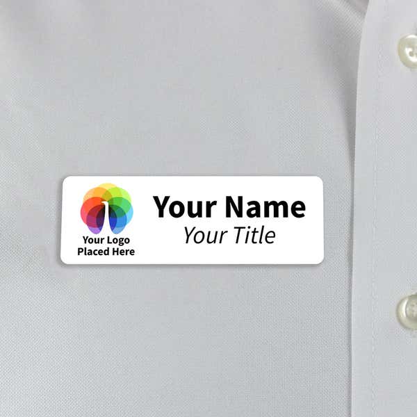 White 1x3  inch name tag - sample template - worn on a off-white dress shirt for size perspective