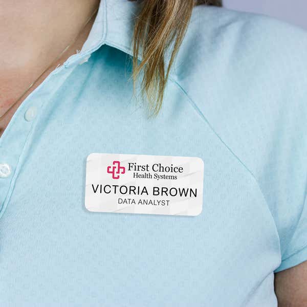 Example name tag - data analyst - worn on a pastel polo