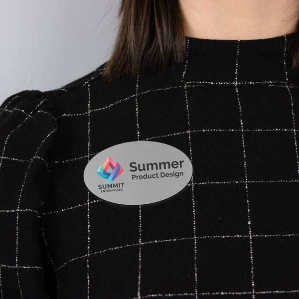 Example of a silver Oval name tag on business attire