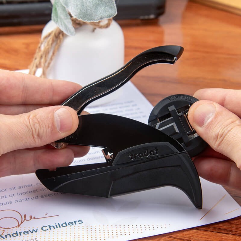 Demonstration of embosser being removed from the back storage