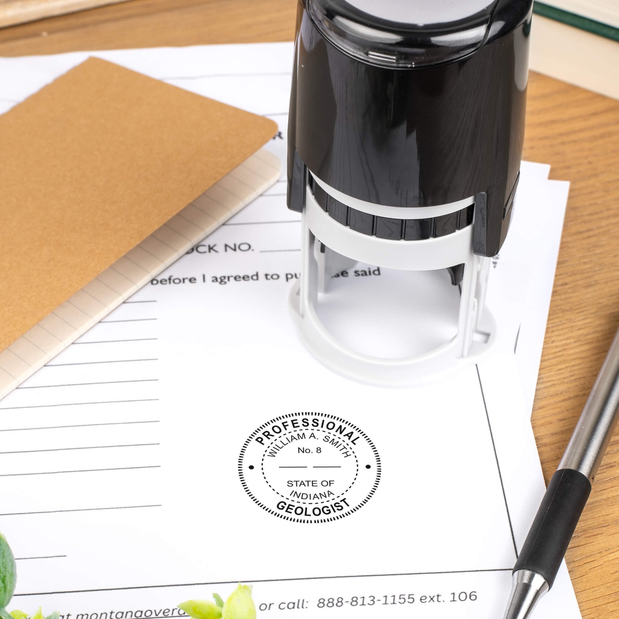A self-inking stamp placed next to the State of Indiana Geologist Seal at the bottom of a document