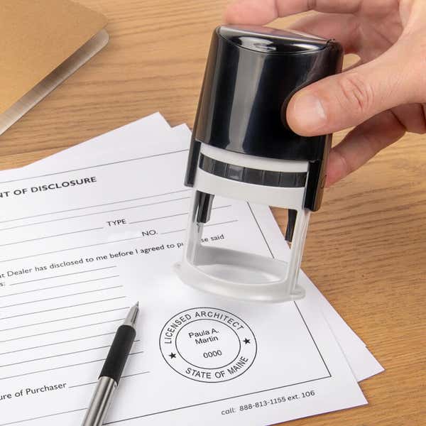 The State of Maine Architect Stamp Seal being used on a document