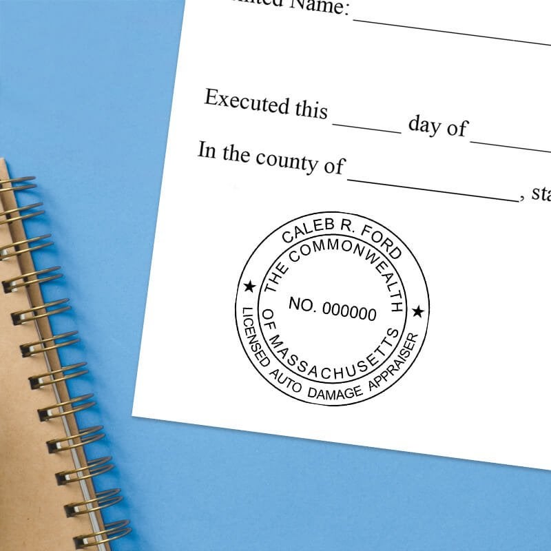 The Massachusetts Auto Appraiser stamp impression on a document next