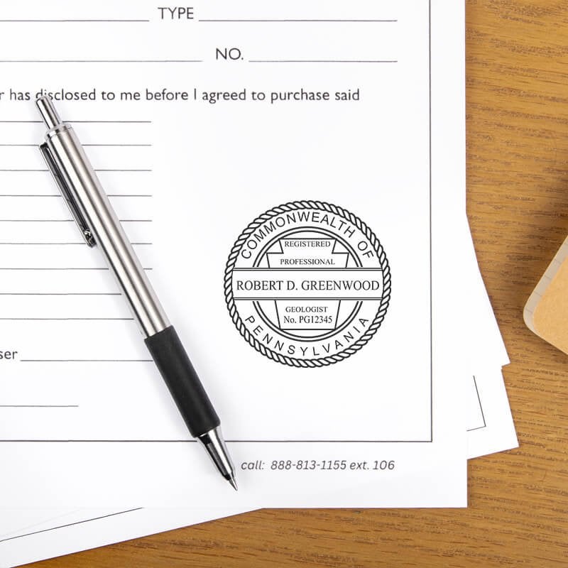The State of Pennsylvania Geologist Seal at the bottom of a document next to a pen