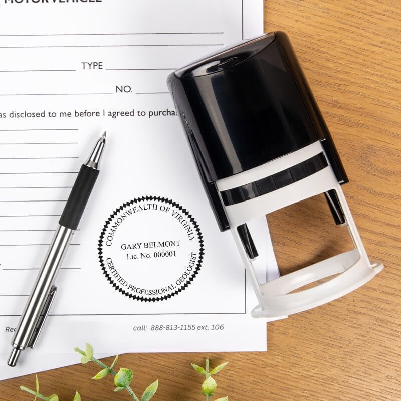 The State of Virginia Geologist Seal at the bottom of a document next to a self-inking stamp and a pen