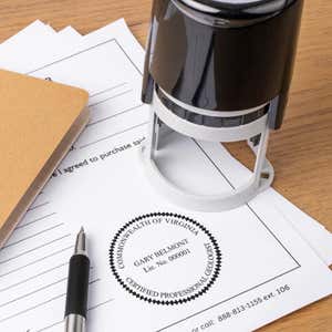 A self-inking stamp placed next to the State of Virginia Geologist Seal at the bottom of a document