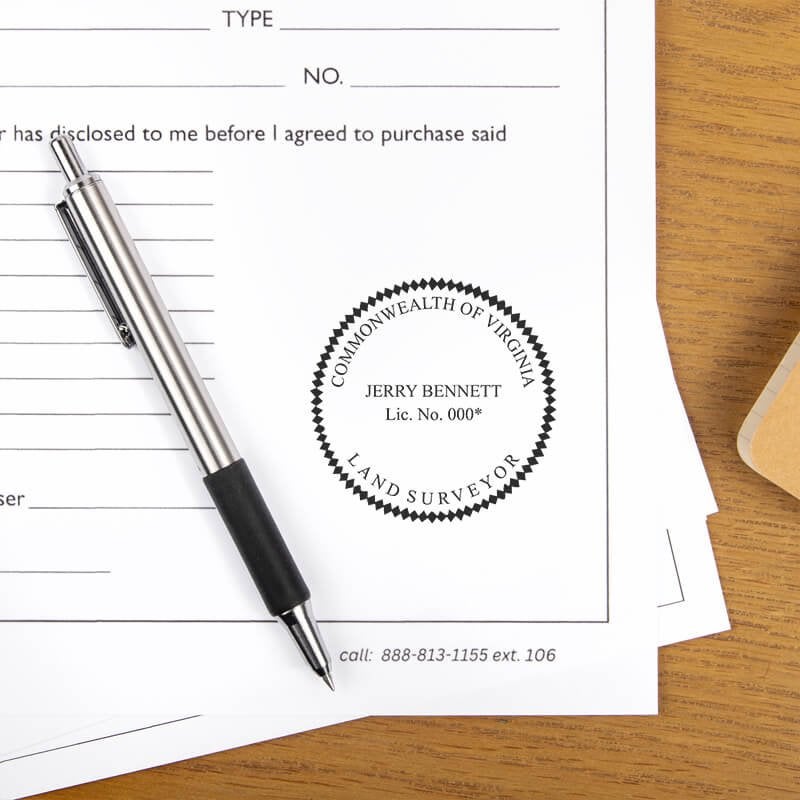 The State of Virginia Land Surveyor Seal at the bottom of a document next to a pen