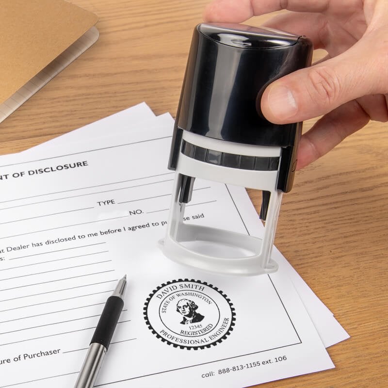 The State of Washington Engineer Seal being used on a document 