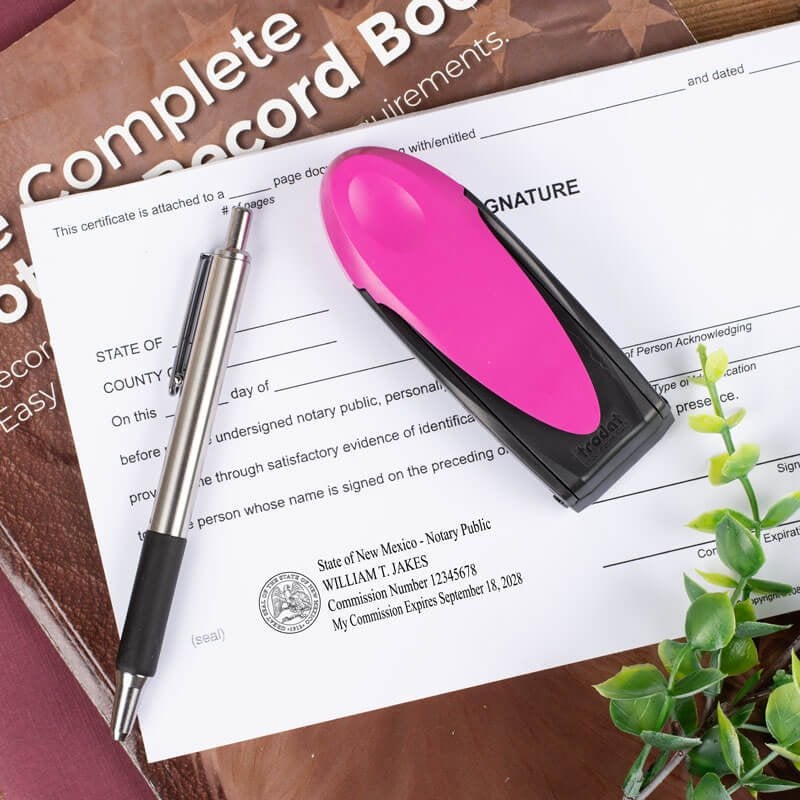New Mexico Pink Rectangle Notary Pocket Stamp Closed on a Document