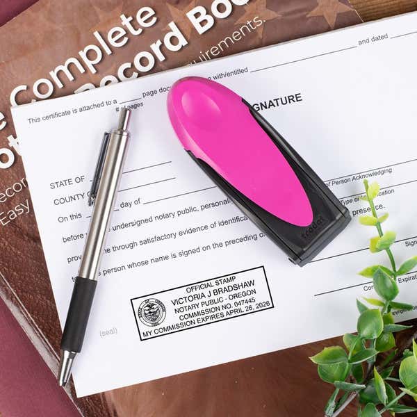 Oregon Notary Pink Stamp Flat lay on document