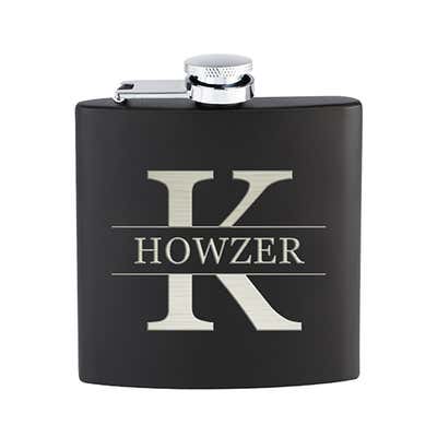 Black flask with initial and name overlay engraved in silver text