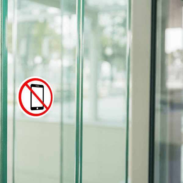 No cell phone decal displayed on a glass door