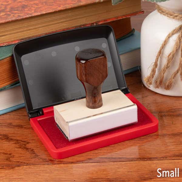 Opened Small Red Ink Pad with Hand Stamp on Top