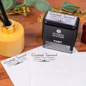 Natural Deco Accent Return Address Stamp Design stamped on two envelopes next to self inking stamp body