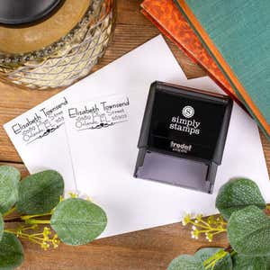 Overlay Shot of Natural Deco Accent Return Address Stamp Design stamped on two envelopes next to self inking stamp body