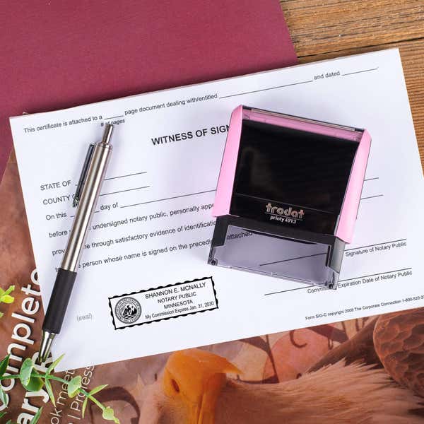 Minnesota Pink Rectangle Notary Stamp on a document