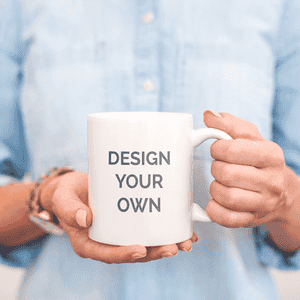 Person holding the white coffee mug