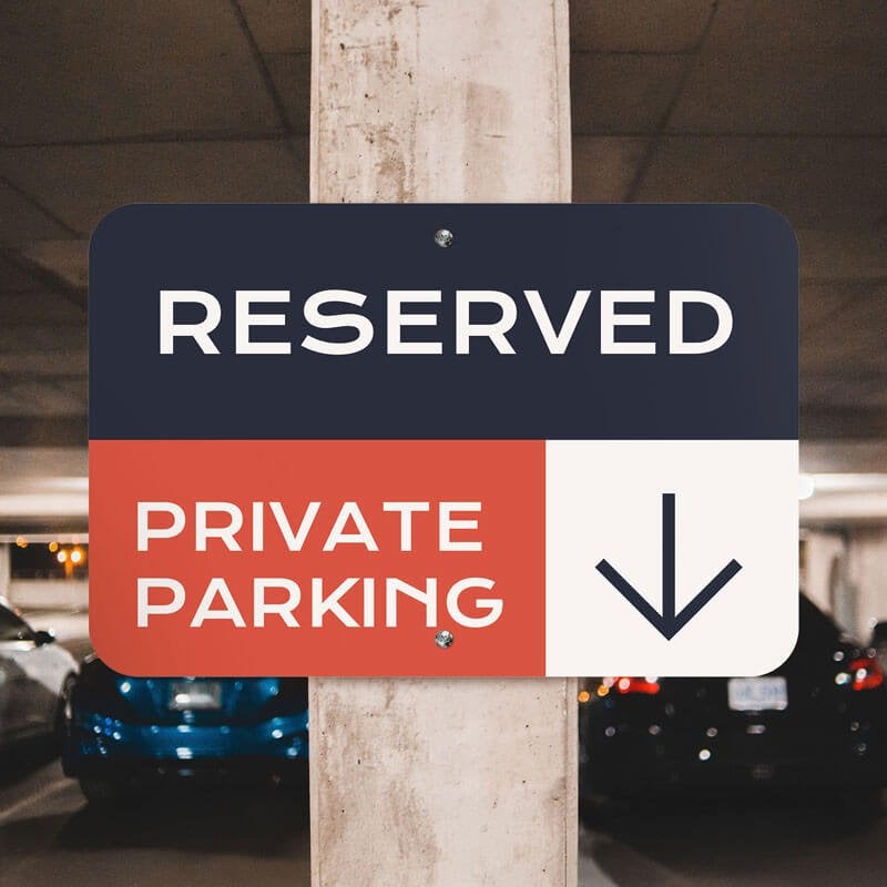Custom reserved private parking sign with navy, red and white background with downward-pointing arrow Custom reserved private parking sign with navy, red and white background with downward-pointing arrow
