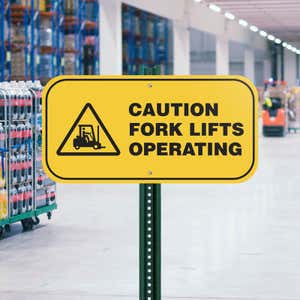 A Yellow Aluminum Caution Sign for a Fork Lifts Operating