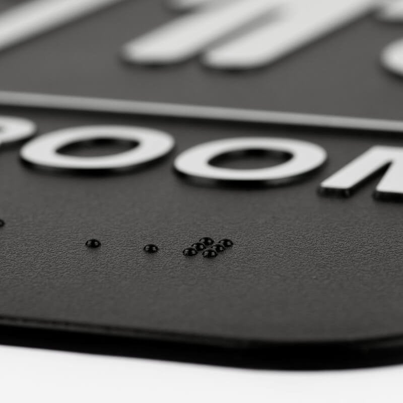 Close up of the Braille on the sign