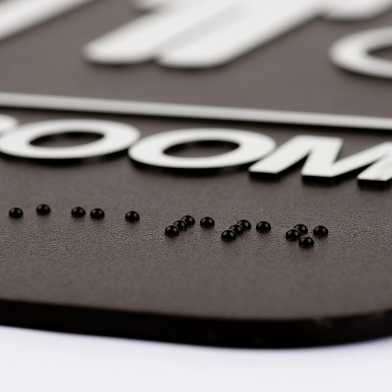 Close up of the Braille on the sign