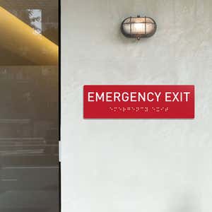 Custom ADA sign for an emergency exit