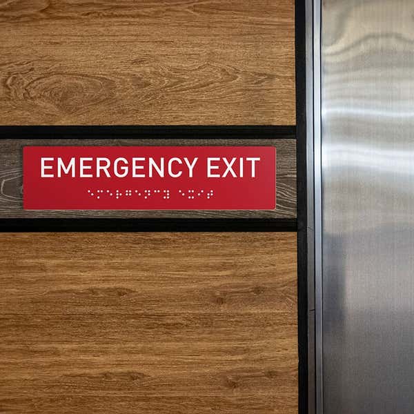 Custom ADA sign for an emergency exit