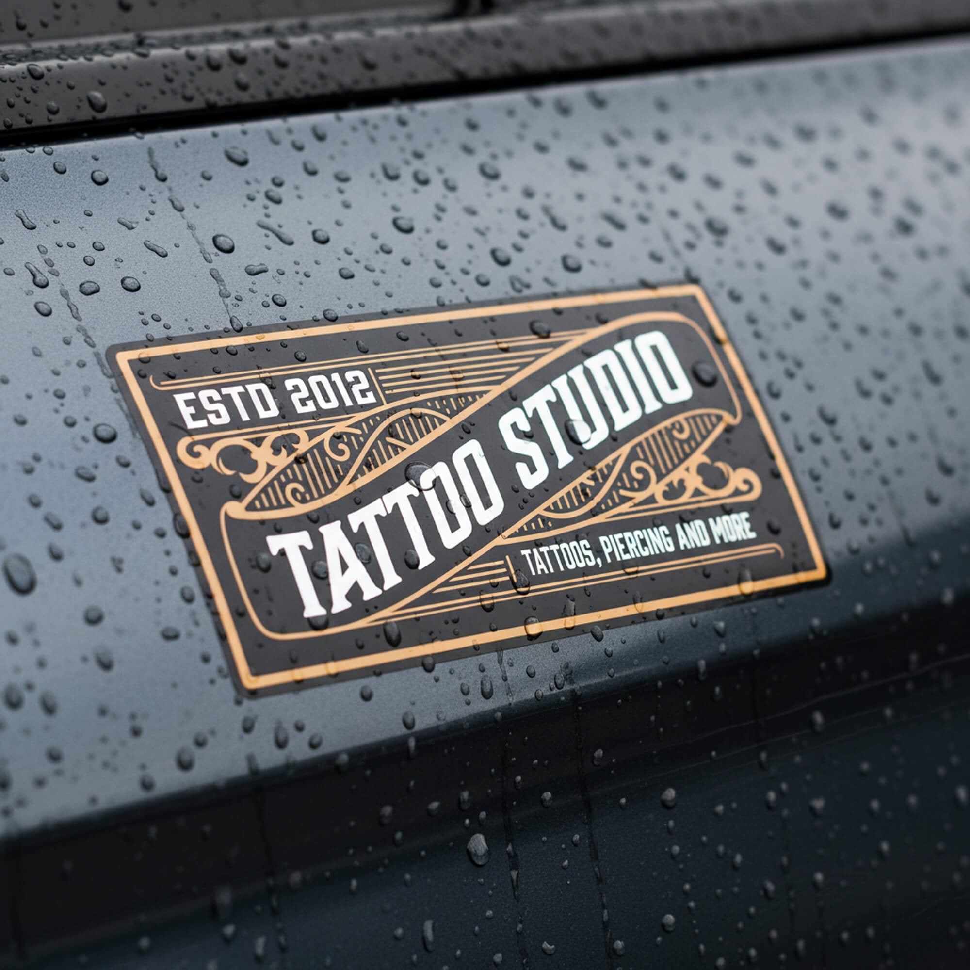 A custom horizontal vinyl sticker for a tattoo shop