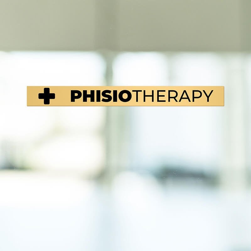 1x10 custom engraved brass sign displayed on a window 1x10 custom engraved brass sign displayed on a window