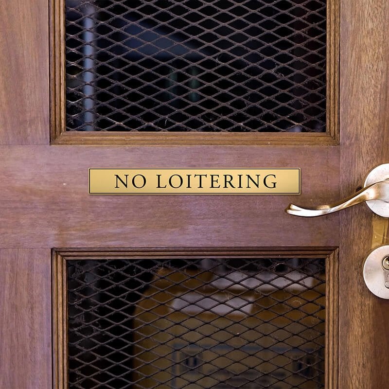 1x8 custom engraved brass sign displayed on a door 1x8 custom engraved brass sign displayed on a door