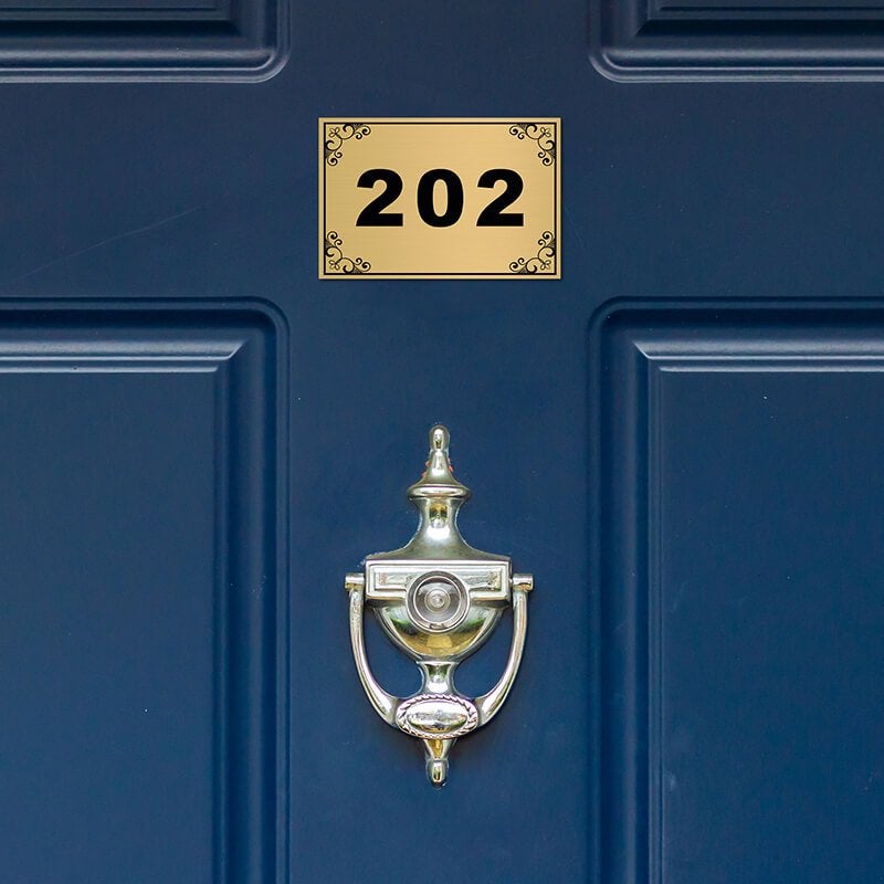 2x3 custom engraved brass sign displayed on a door 2x3 custom engraved brass sign displayed on a door