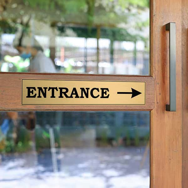 3x16 custom engraved brass sign on a door