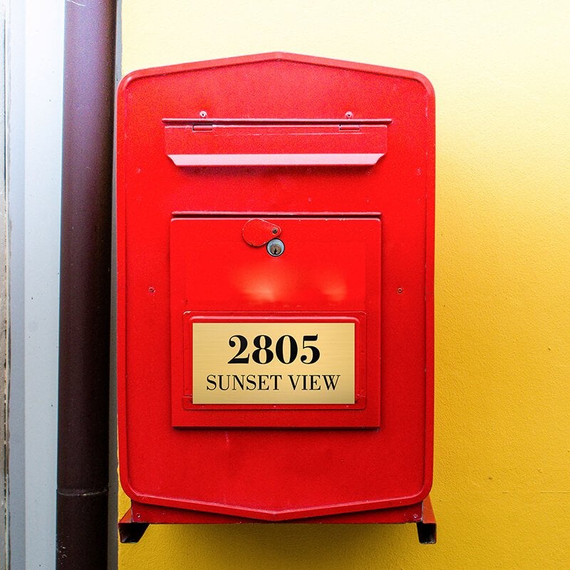 3x6 custom engraved brass sign on a red mailbox 3x6 custom engraved brass sign on a red mailbox
