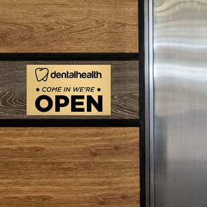 6x10 custom engraved brass sign displayed on a wall