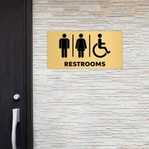 6x12 custom engraved brass sign displayed by a window