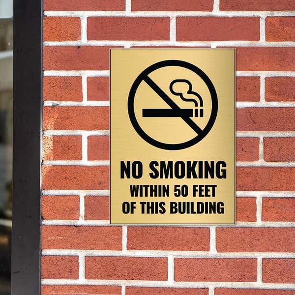 14x10 engraved brass sign on a brick wall