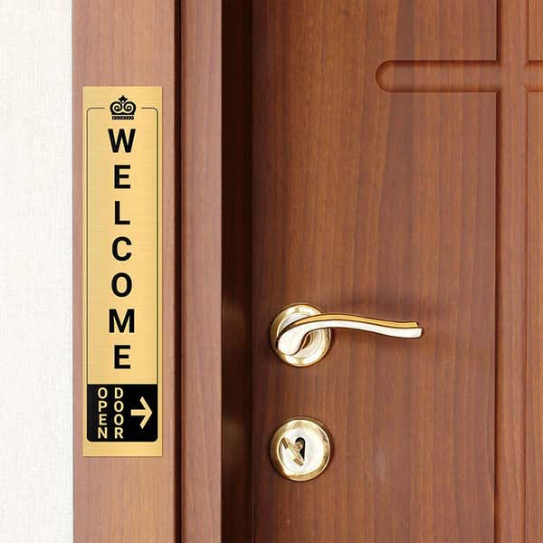 14x3 custom engraved brass sign next to a door