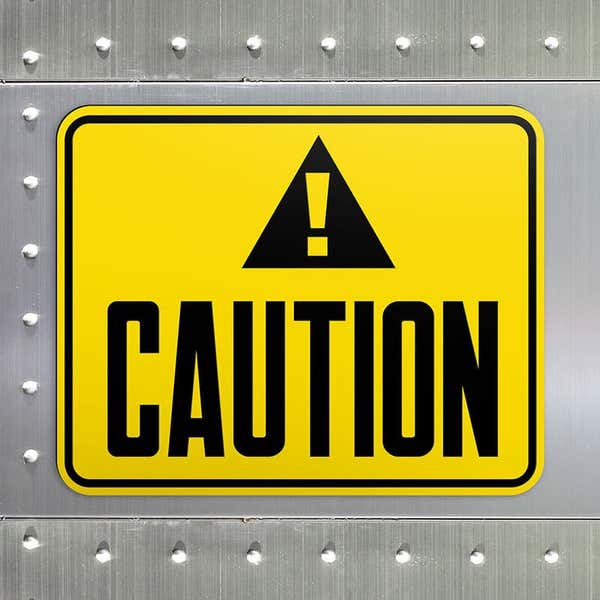 Engraved plastic caution sign