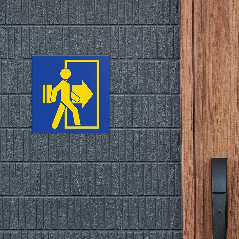 A blue and yellow plastic sign for an exit A blue and yellow plastic sign for an exit