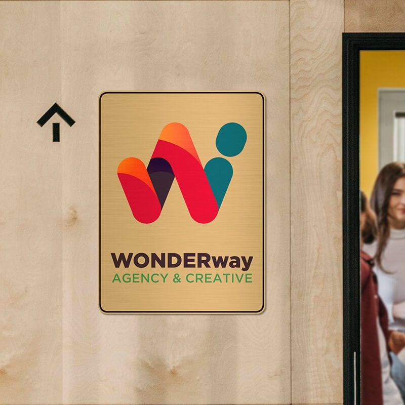 16" x 12" Printed brass sign displayed next to a doorway 