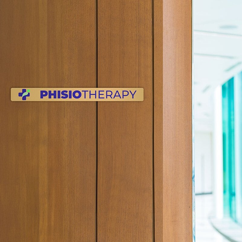 1x10  printed brass sign displayed by a doorway