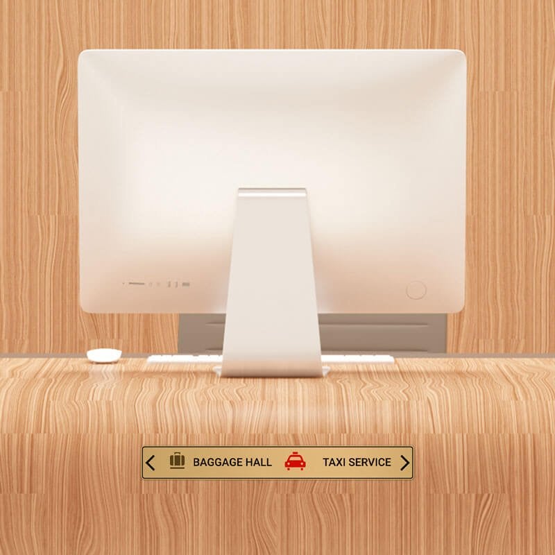 2x16 printed brass sign displayed at a front desk