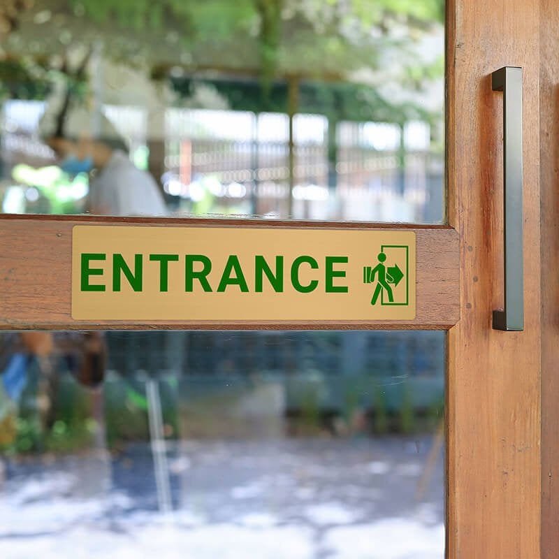 3x12 printed brass sign displayed on a front door 3x12 printed brass sign displayed on a front door