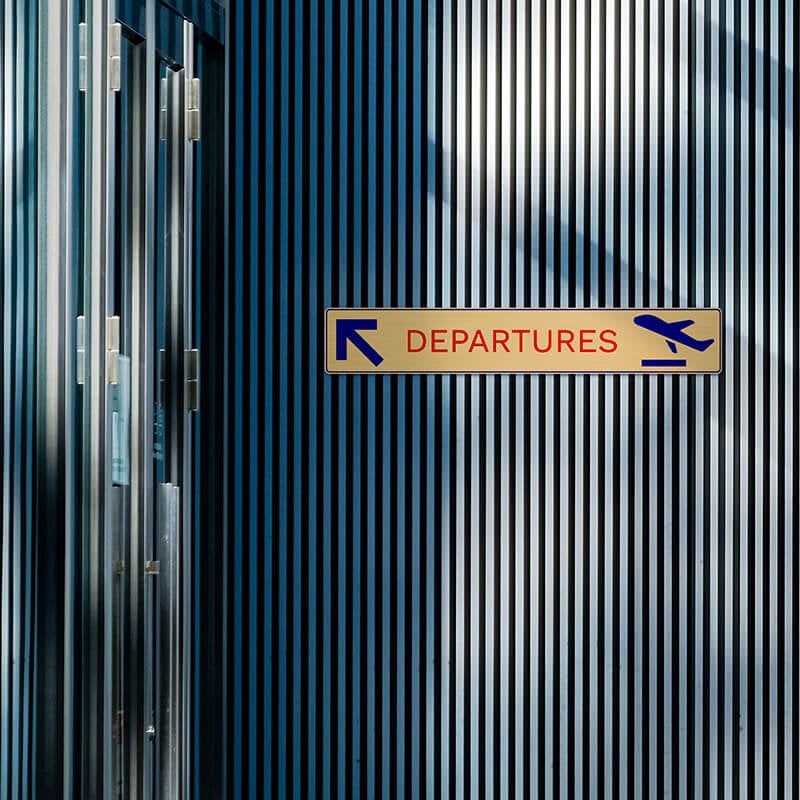 3" x 18" printed brass sign displayed on a wall 3" x 18" printed brass sign displayed on a wall