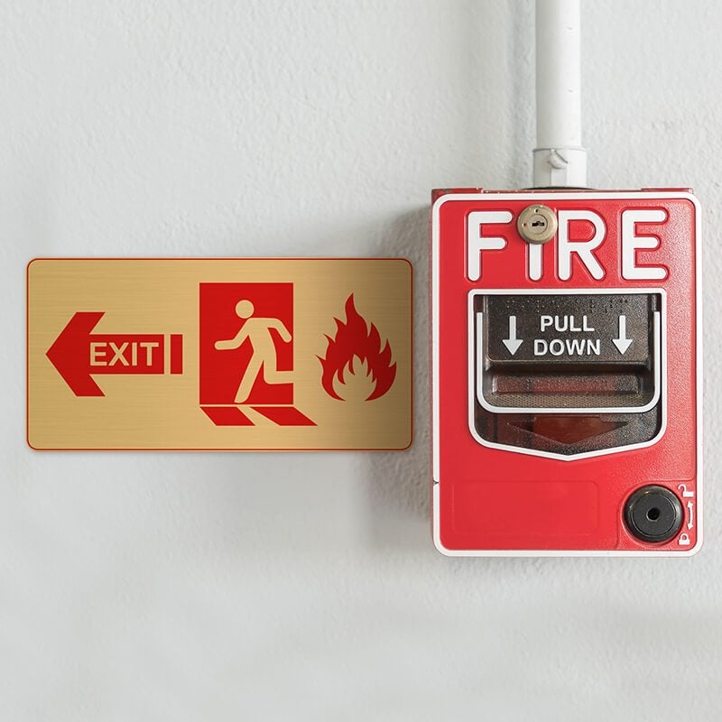3x6 printed brass sign next to a fire alarm 3x6 printed brass sign next to a fire alarm