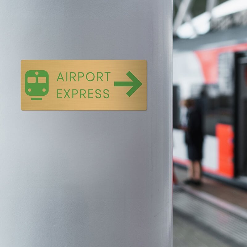 4x10 printed brass sign displayed by a train station 4x10 printed brass sign displayed by a train station