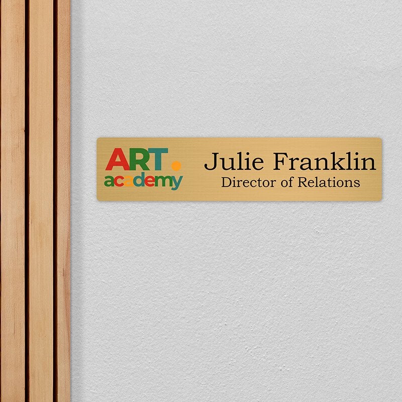 4x18 printed brass sign displayed by a doorway 4x18 printed brass sign displayed by a doorway