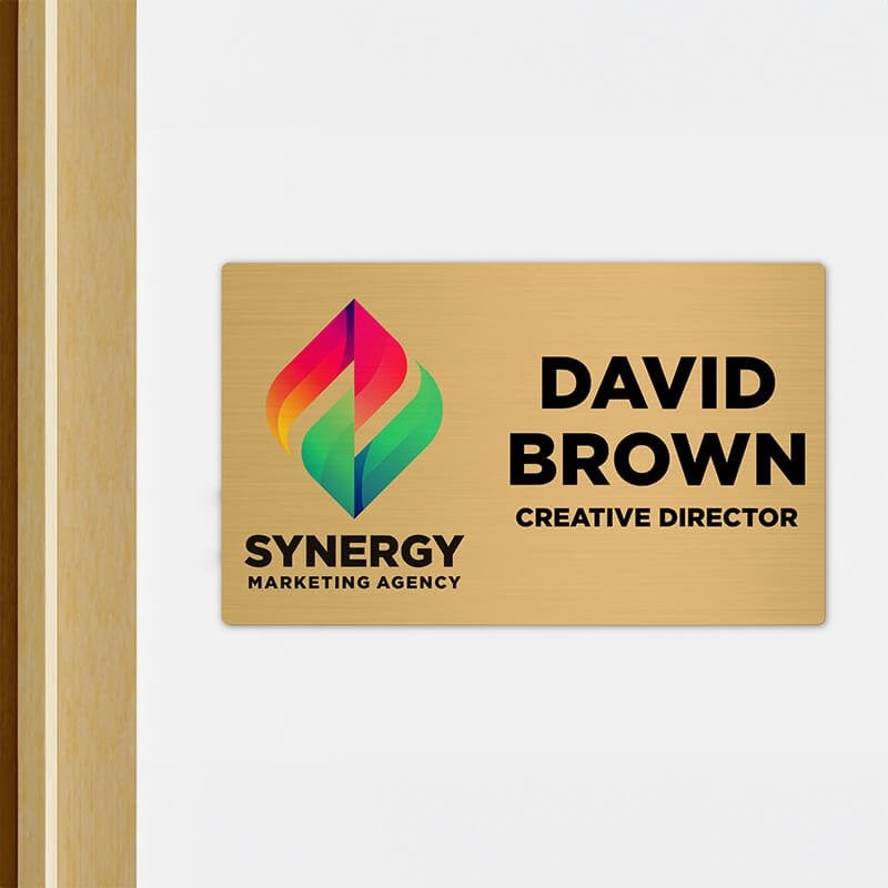 6x10 printed brass sign displayed outside of an office