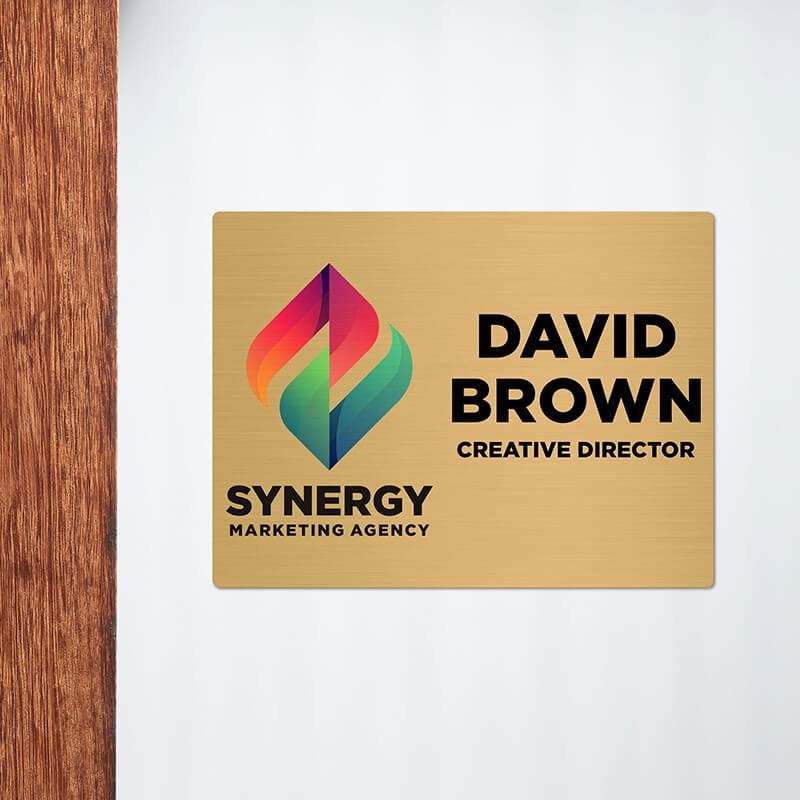 6x8 printed brass sign displayed next to a doorway 6x8 printed brass sign displayed next to a doorway