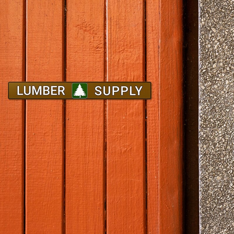 1" x 8" custom plastic sign displayed on a wooden wall